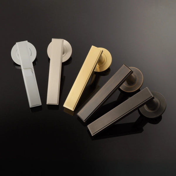 Jesper door lever on rose - solid brass