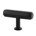 Black t-shaped cabinet knob on a white background