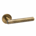 Hammered lever on rose door handle - Antique brass