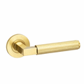 Knurled hurricane lever on rose door handle - brass