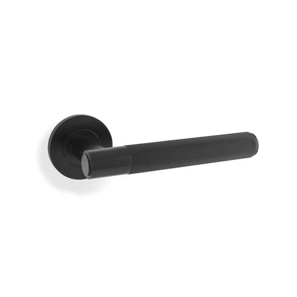 Spitfire REEDED door lever on rose - solid brass
