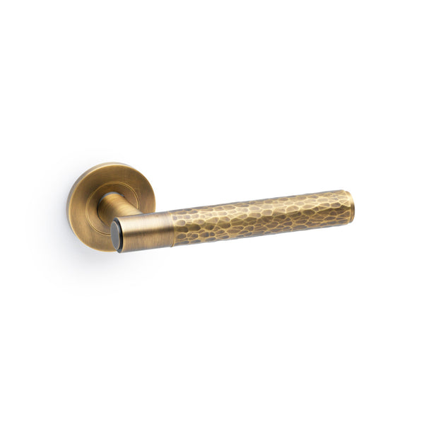 Hammered door lever on rose - solid brass