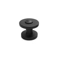 Black cabinet knob on a white background