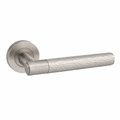 Door handle with metallic finish and textured grip on a white background