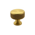 Gold cabinet knob on a white background